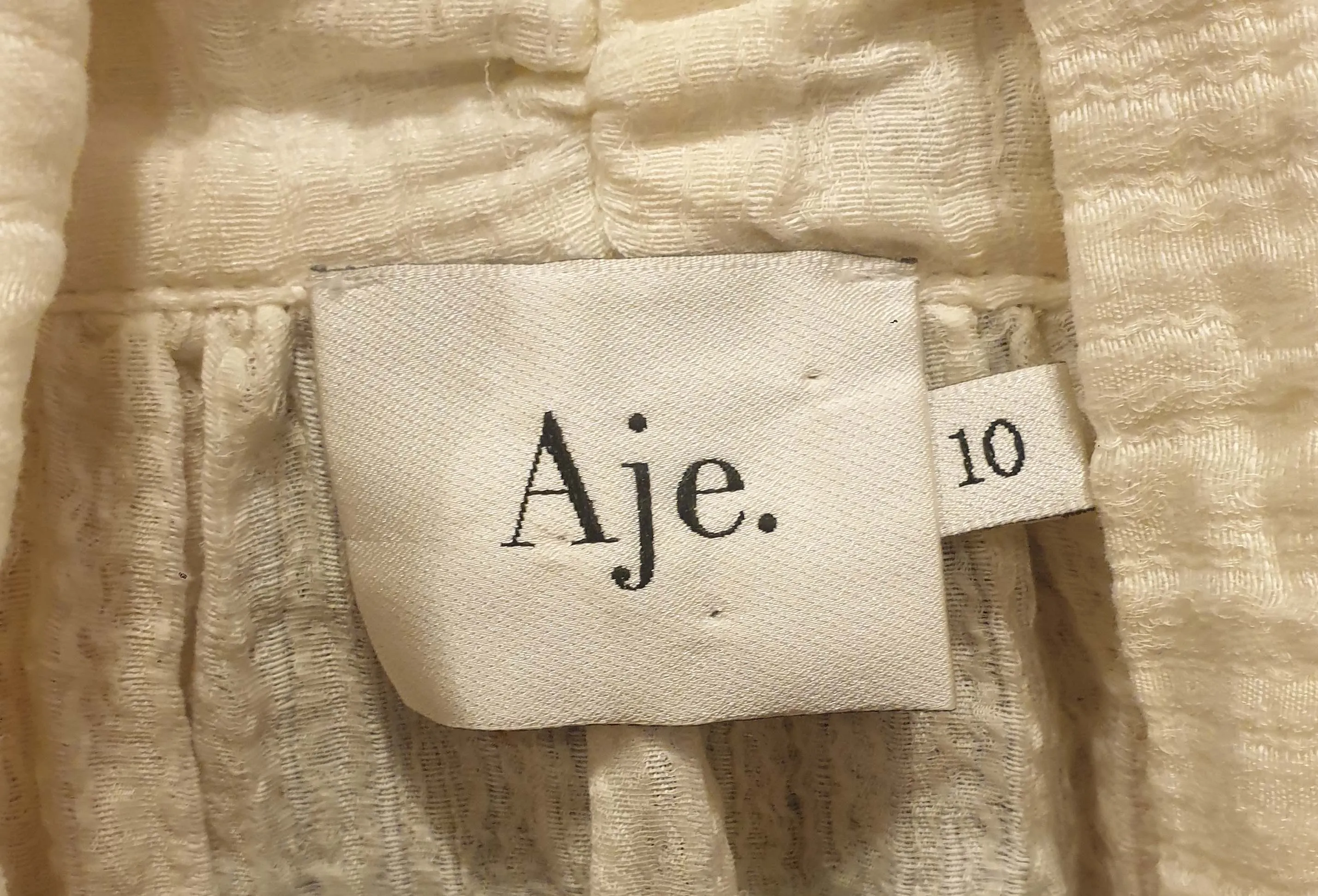 Aje cream silk-linen mix short sleeve top with beautiful front drape size 10