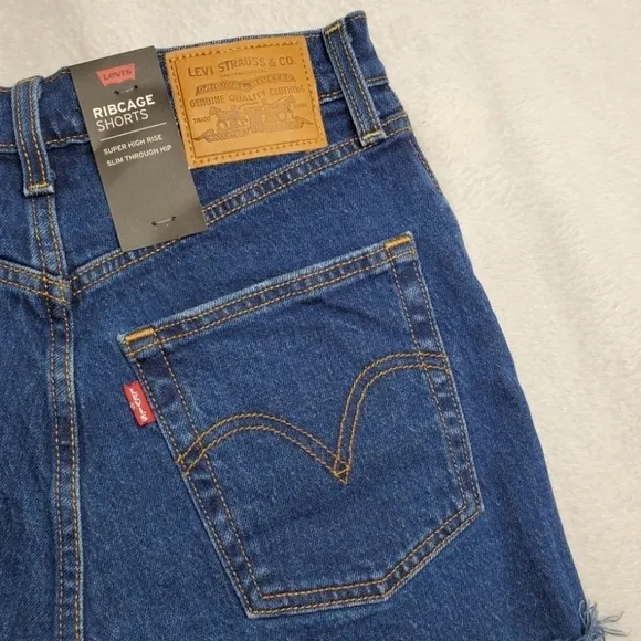 Levi's Revolve Blue Dark Wash High Rise Distressed Ribcage Denim Cut Off Shorts
