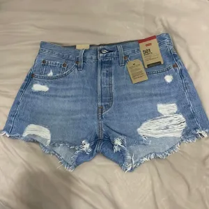 Women Levi’s 501 Distressed Denim Shorts